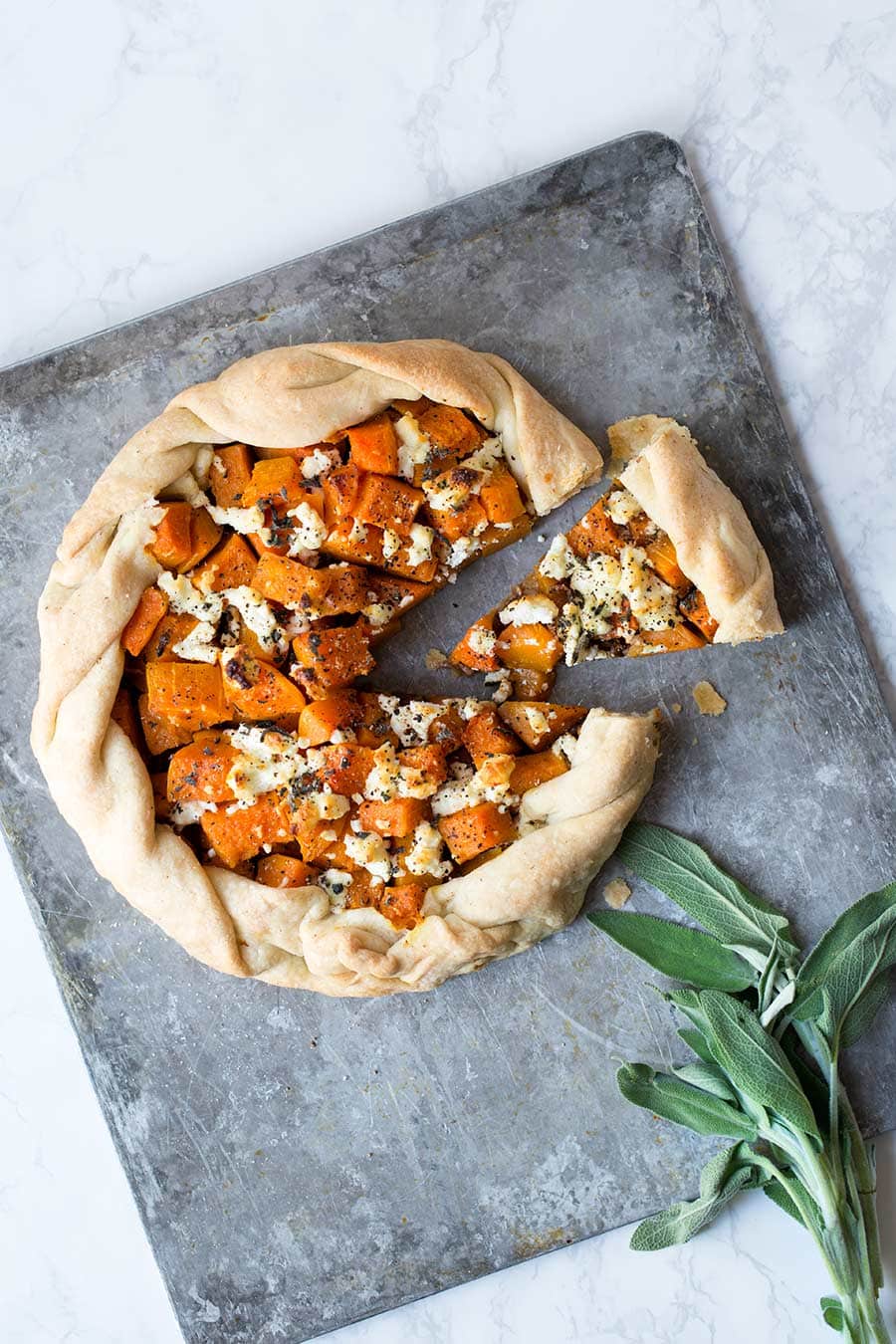 This butternut squash galette with goat cheese is a beautiful, rustic tart that works well as a fall or winter party appetizer. Your kitchen will smell amazing.