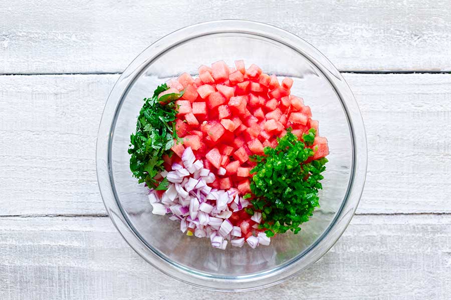 Ingredients for salsa in a bowl