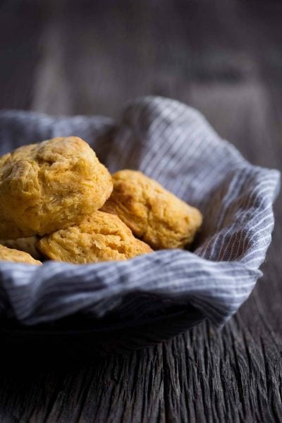 A photo of sweet potato buttermilk biscuits in a basket.