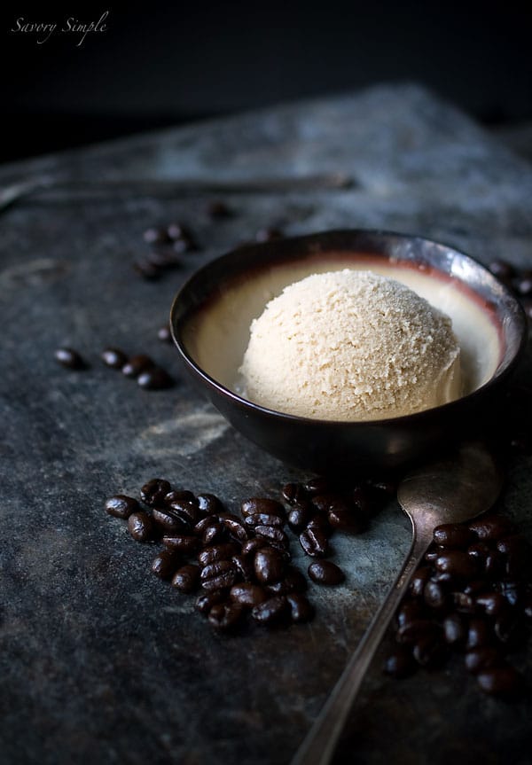 Espresso Coconut Milk Ice Cream in a bowl, surrounded by espresso beans. 