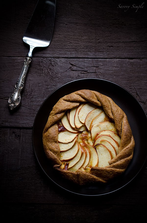 This cheesy apple, cheddar and caramelized onion galette has a flaky whole wheat crust and tons of flavor. It's a perfect, light appetizer. This cheesy apple, cheddar and caramelized onion galette has a flaky whole wheat crust and tons of flavor. It's a perfect, light appetizer.