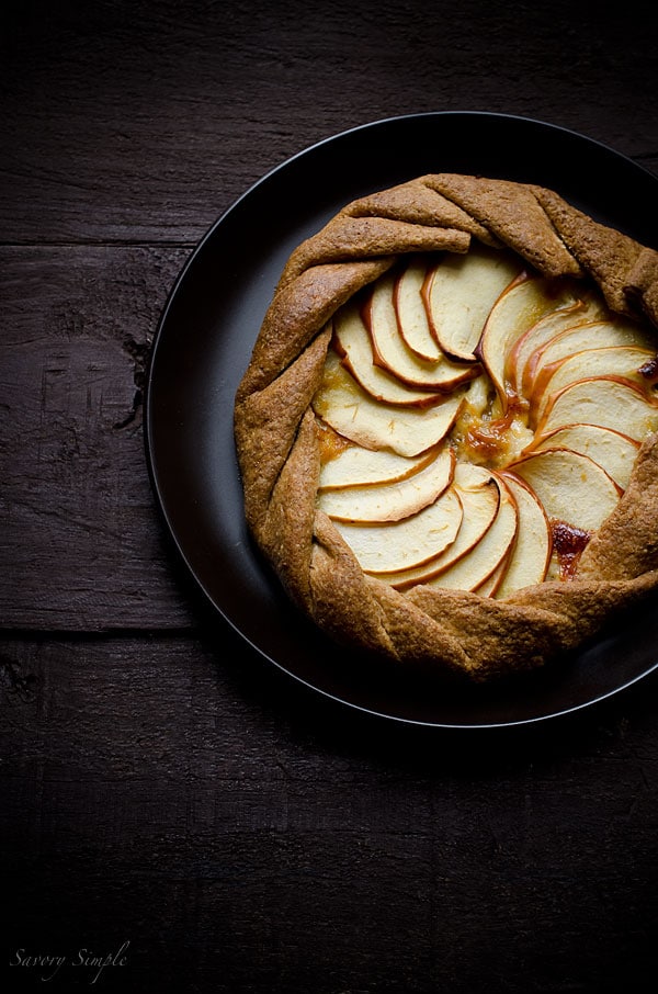 This cheesy apple, cheddar and caramelized onion galette has a flaky whole wheat crust and tons of flavor. It's a perfect, light appetizer. This cheesy apple, cheddar and caramelized onion galette has a flaky whole wheat crust and tons of flavor. It's a perfect, light appetizer.