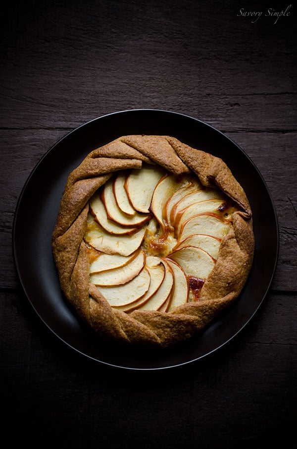 This cheesy apple, cheddar and caramelized onion galette has a flaky whole wheat crust and tons of flavor. It's a perfect, light appetizer. This cheesy apple, cheddar and caramelized onion galette has a flaky whole wheat crust and tons of flavor. It's a perfect, light appetizer.