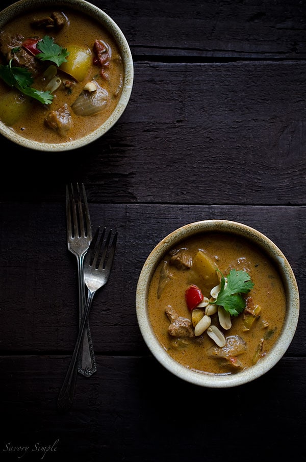 Chicken Massaman Curry is an easy, gluten-free weeknight dinner option. An overhead photo of chicken massaman curry in bowls