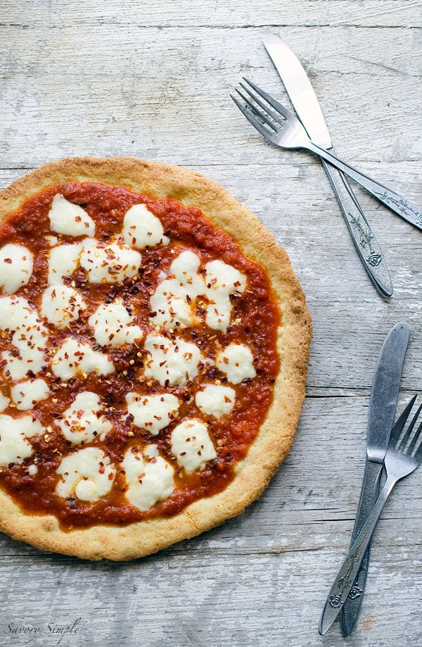 This grain-free paleo pizza crust uses almond meal and arrowroot in place of traditional flour. You'll never miss the wheat!