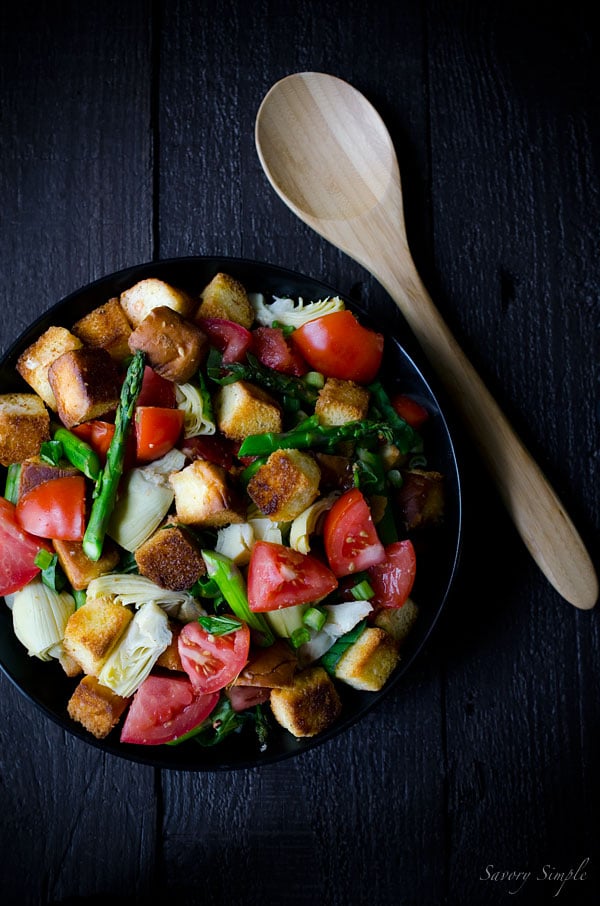 This Spring Panzanella Salad uses hawaiian sweet rolls for a touch of sweetness (though regular crusty bread may be substituted). Asparagus, spring onions and artichokes provide a seasonal twist!