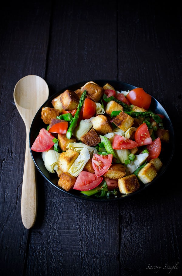This Spring Panzanella Salad uses hawaiian sweet rolls for a touch of sweetness (though regular crusty bread may be substituted). Asparagus, spring onions and artichokes provide a seasonal twist!