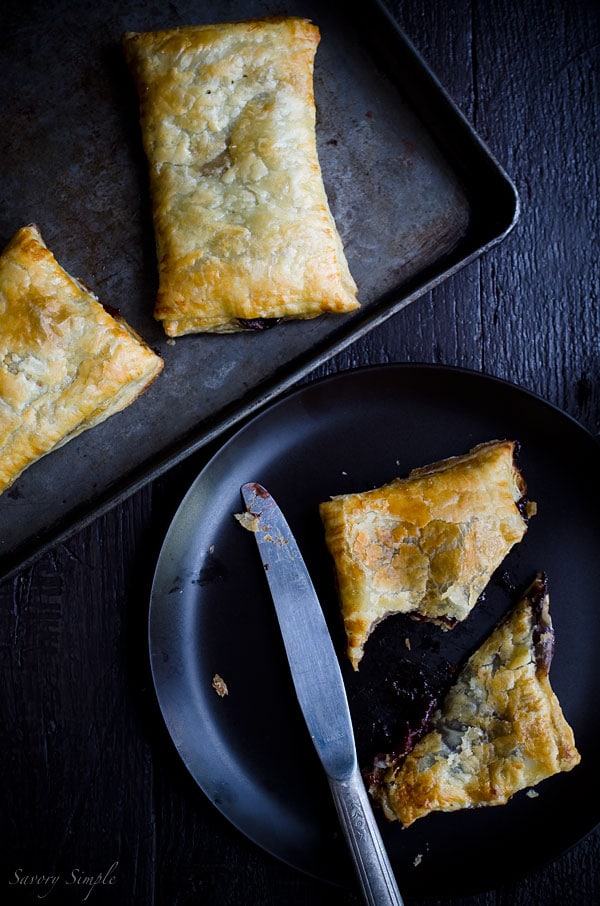 Macerated Cherry Nutella Pop Tarts are pretty much everything you want in a dessert: flaky pastry, creamy chocolate and a boozy fruit filling!