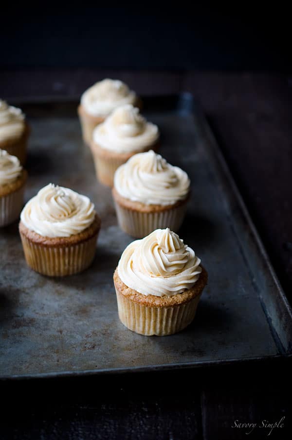 Summer peaches, boozy buttercream... what more does one need in a cupcake? You NEED these Peach Bourbon Cupcakes from Savory Simple!