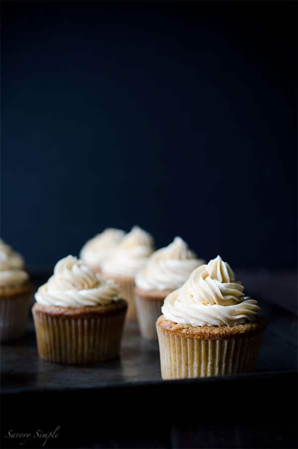 Summer peaches, boozy buttercream... what more does one need in a cupcake? You NEED these Peach Bourbon Cupcakes from Savory Simple!