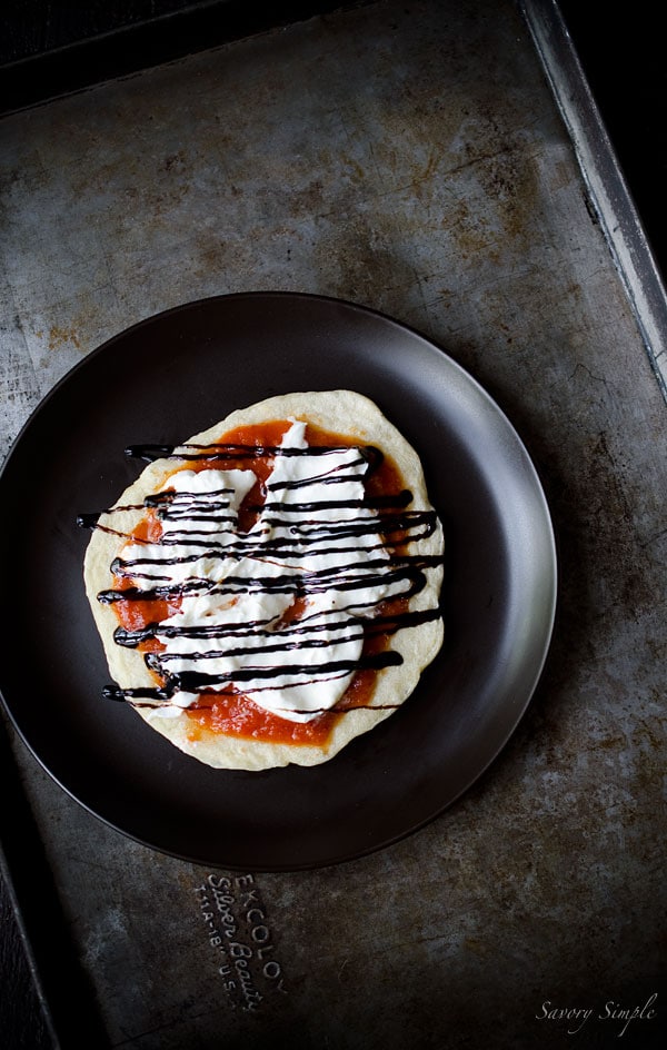 These individual pizzas with pomodoro sauce, burrata cheese and balsamic glaze are a perfectly portioned meal.