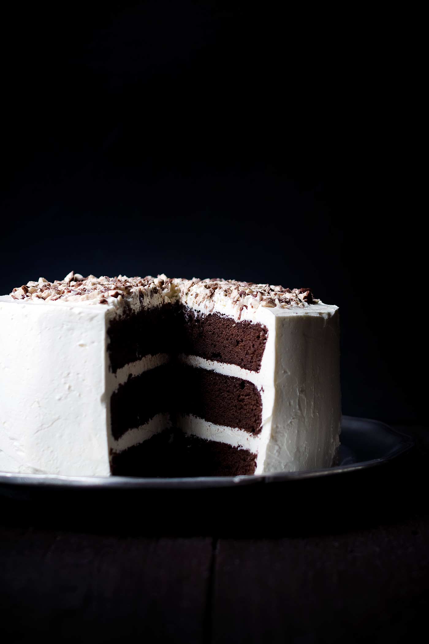 Chocolate Malt Layer Cake is a dense, moist and totally decadent dessert. Chopped malted milk balls add flavor and crunch. You need to try this!