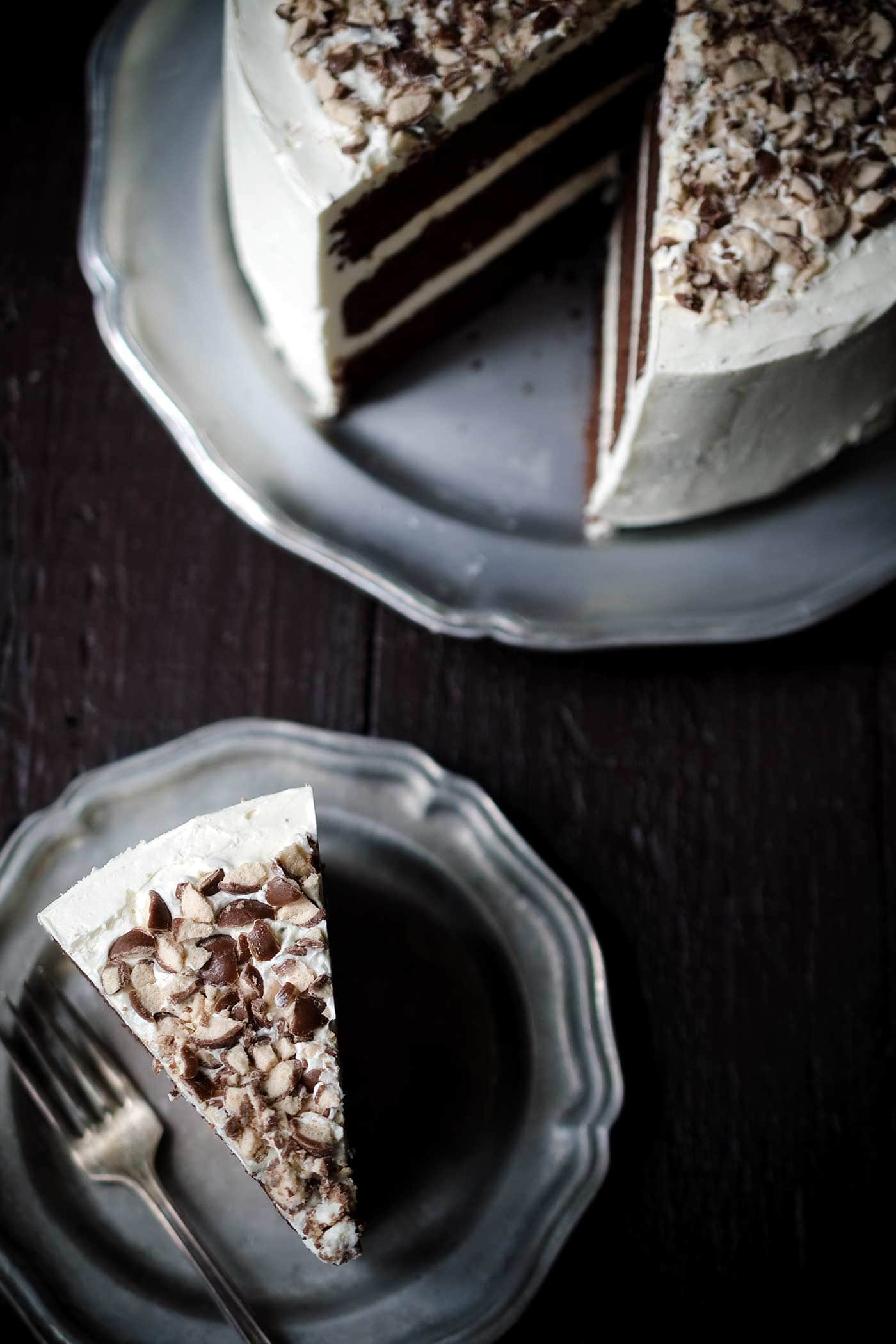 A photo showing a slice of chocolate malt layer cake.
