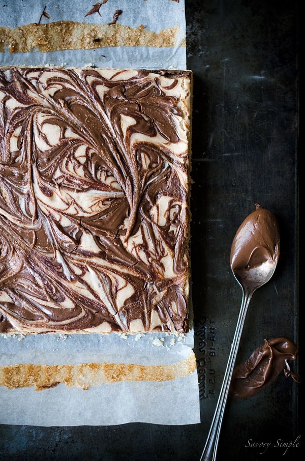 Nutella Cheesecake Bars are the perfect dessert! You won't be able to stop eating them! Get this easy to follow recipe from Savory Simple.