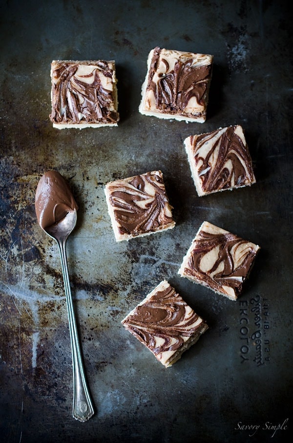 Nutella Cheesecake Bars are the perfect dessert! You won't be able to stop eating them! Get this easy to follow recipe from Savory Simple.