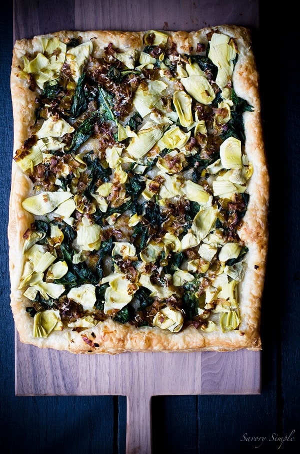 This Spinach, Artichoke and Caramelized Leek Tart is a delicious and flavorful appetizer. Get this easy to follow recipe from Savory Simple!