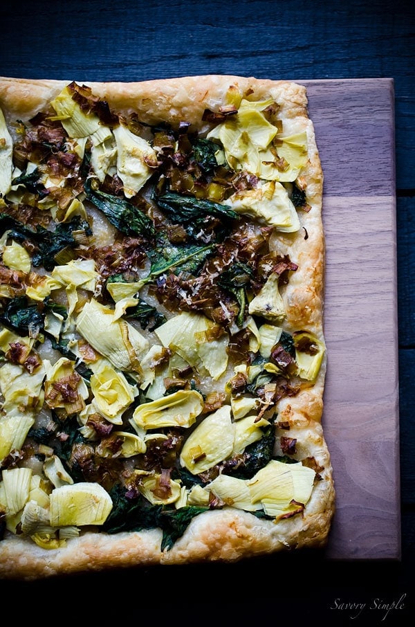 This Spinach, Artichoke and Caramelized Leek Tart is a delicious and flavorful appetizer. Get this easy to follow recipe from Savory Simple!