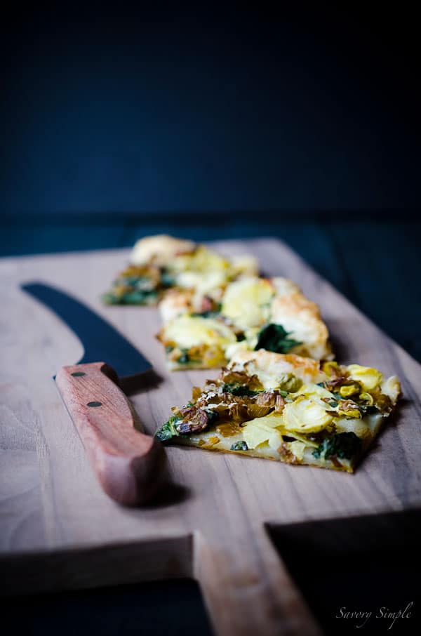 This Spinach, Artichoke and Caramelized Leek Tart is a delicious and flavorful appetizer. Get this easy to follow recipe from Savory Simple!