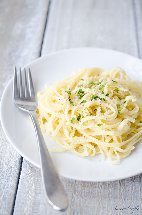 a plate of linguine in garlic parmesan sauce