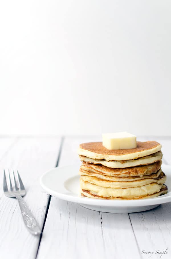 These easy yogurt pancakes are a delicious protein packed breakfast! Get the recipe from SavorySimple.net.