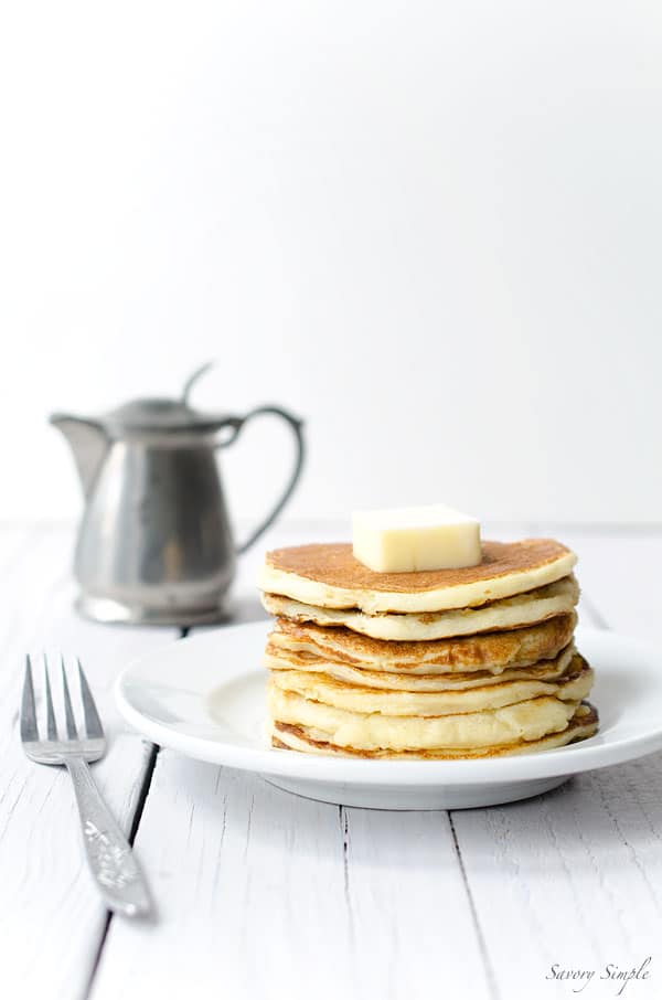These easy yogurt pancakes are a delicious protein packed breakfast! Get the recipe from SavorySimple.net.