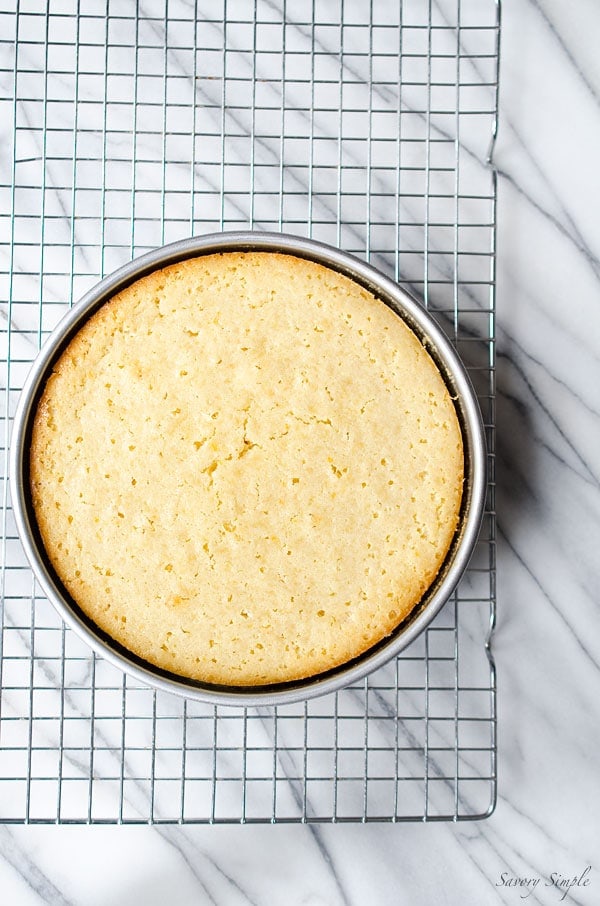 A photo of pineapple cake cooling on a rack, fresh from the oven.
