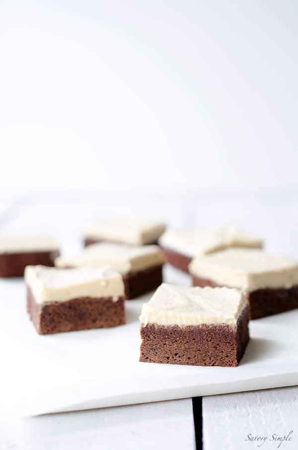 These Chocolate Brownies with Salted Tahini Frosting are a simple, decadent dessert. Get the easy-to-follow recipe from SavorySimple.net