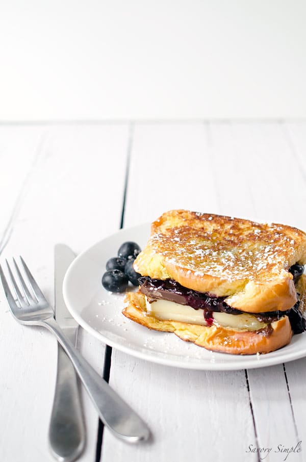 Grilled Brioche with Brie, Dark Chocolate and Blueberries is amazing for dessert or brunch! Get the recipe from SavorySimple.net