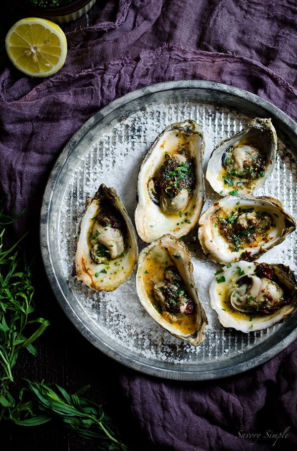 Grilled Oysters with Chipotle Tarragon Butter and Gremolata are a fun and flavorful summer treat! You’ll never want plain oysters again! Get the recipe from SavorySimple.net