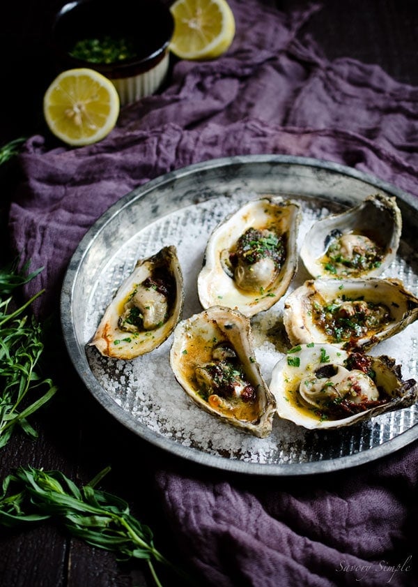 Grilled Oysters with Chipotle Tarragon Butter and Gremolata are a fun and flavorful summer treat! You’ll never want plain oysters again! Get the recipe from SavorySimple.net