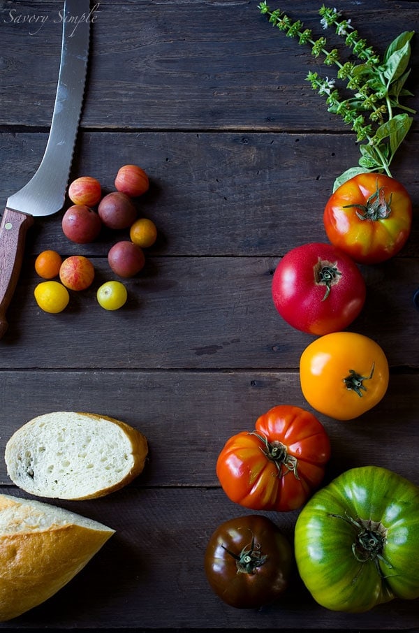 This Heirloom Panzanella Salad is a perfect way to enjoy summer's most beautiful tomato! Get the recipe from SavorySimple.net
