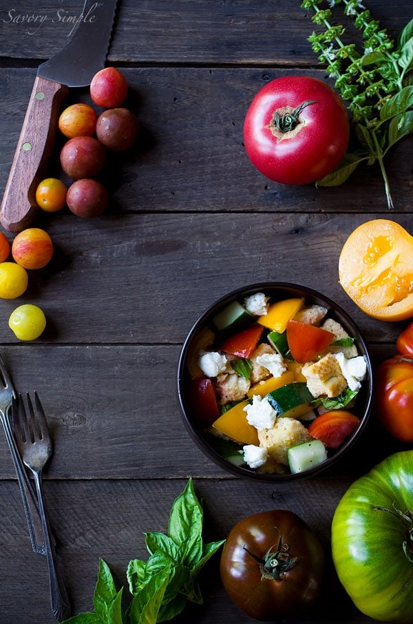 This Heirloom Tomato Panzanella Salad is a perfect way to enjoy summer's most beautiful tomato! Get the recipe from SavorySimple.net
