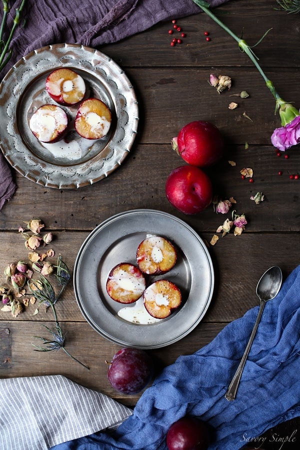 These roasted plums with creme fraiche are a simple, elegant dessert! Brown sugar adds just the right amount of sweetness. Get the recipe from SavorySimple.net.