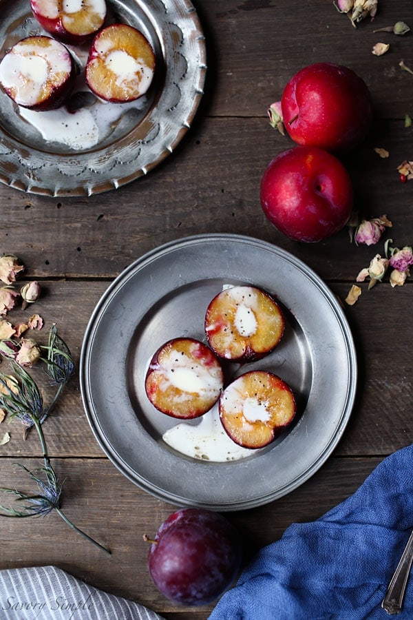 These roasted plums with creme fraiche are a simple, elegant dessert! Brown sugar adds just the right amount of sweetness. Get the recipe from SavorySimple.net.