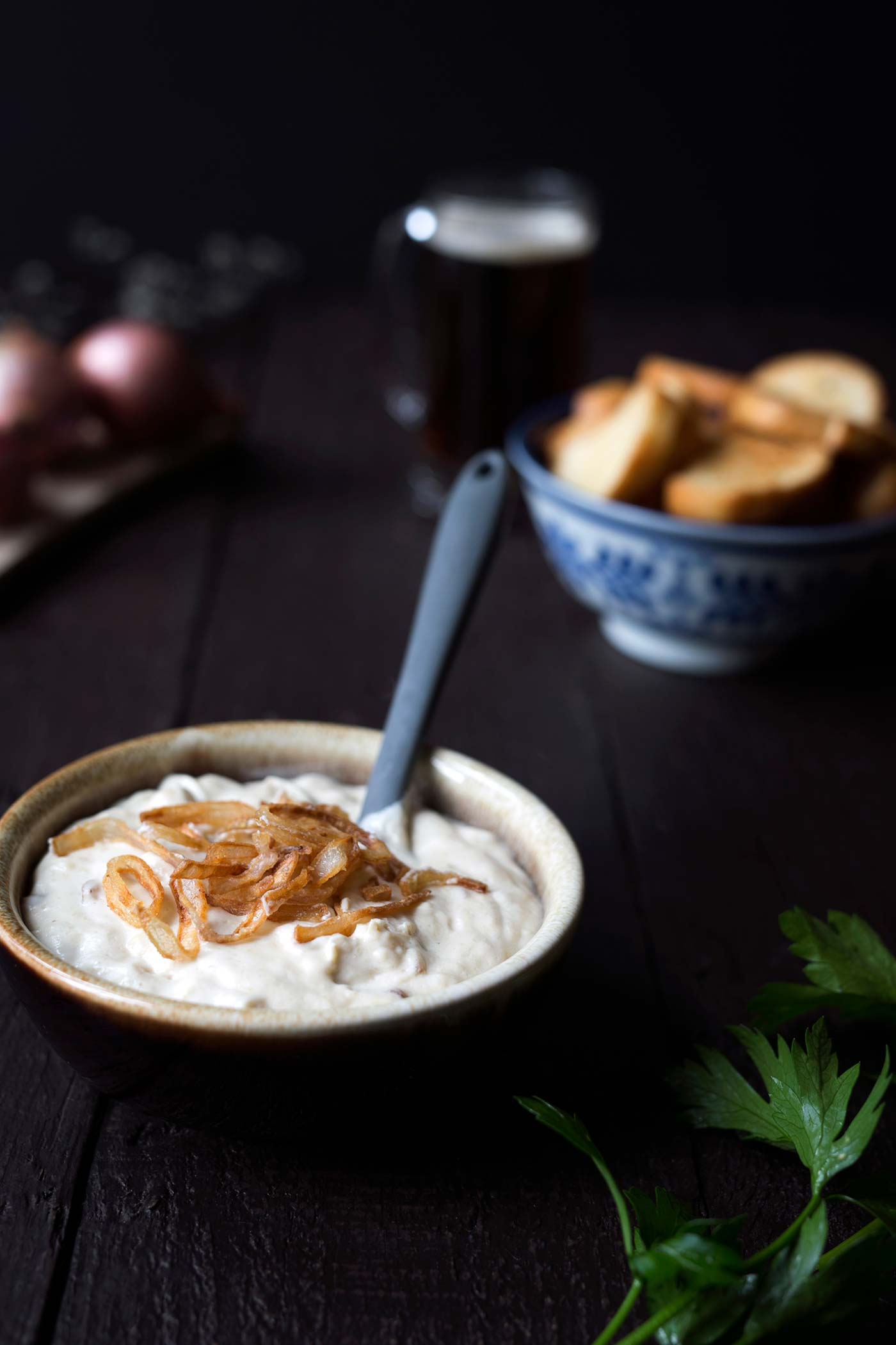 This Parmesan Beer Cheese Dip with Crispy Shallots from The Beeroness is seriously addicting! Serve is at parties or at your next football game viewing.