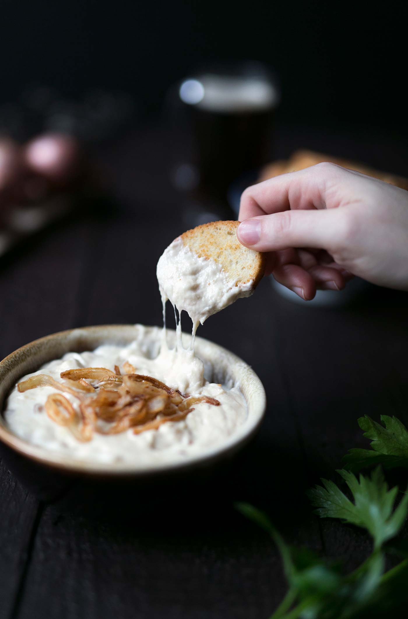 This Parmesan Beer Cheese Dip with Crispy Shallots from The Beeroness is seriously addicting! Serve is at parties or at your next football game viewing.
