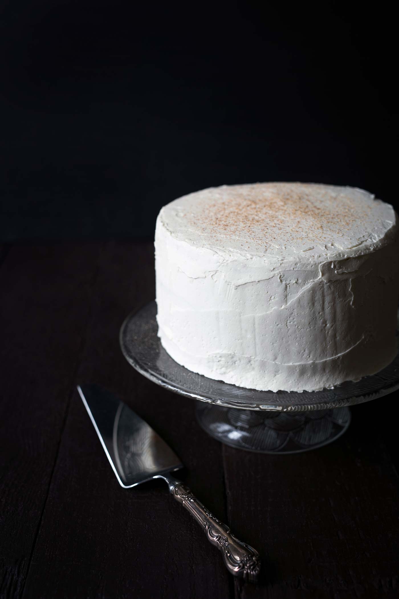 Impress your guests with this gorgeous and impressive Eggnog Rum Layer Cake! It's perfect for holiday parties. Get the recipe from SavorySimple.net
