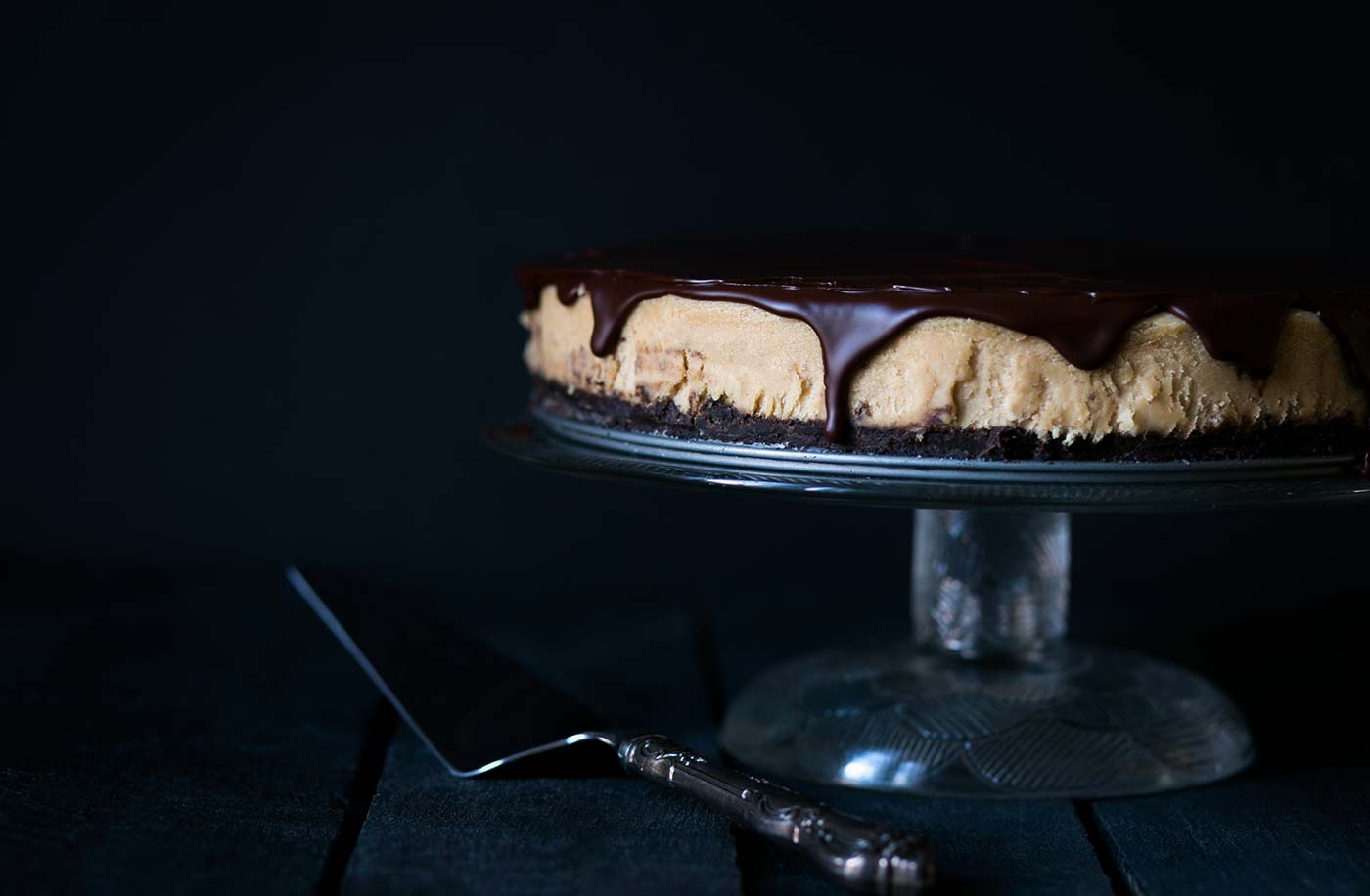 This decadent Chocolate Peanut Butter Cheesecake has a chocolate graham cracker crust, a light and fluffy peanut butter filling, and is topped with a bittersweet chocolate ganache. Get the recipe from SavorySimple.net