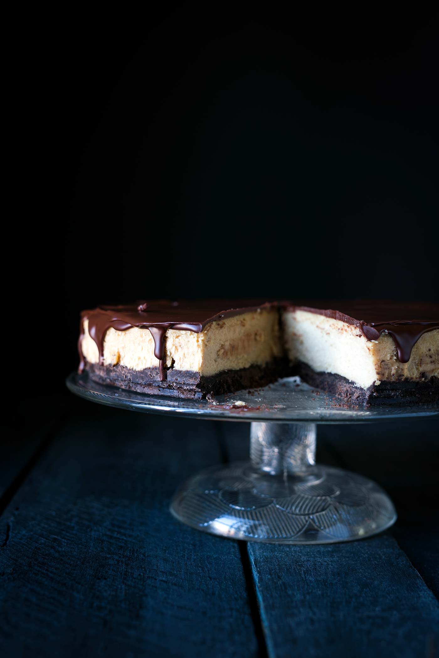 This decadent Chocolate Peanut Butter Cheesecake has a chocolate graham cracker crust, a light and fluffy peanut butter filling, and is topped with a bittersweet chocolate ganache. Get the recipe from SavorySimple.net