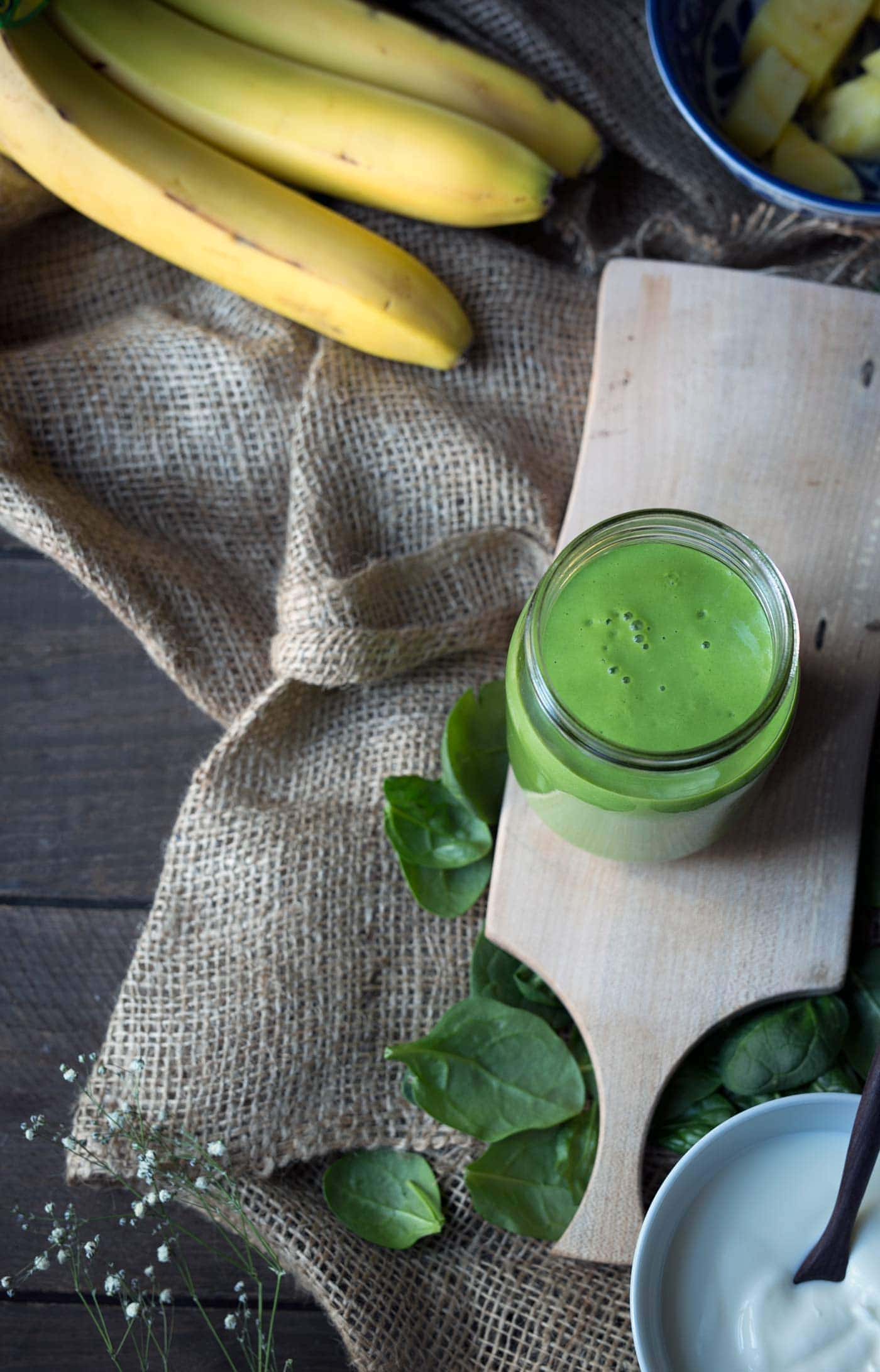 This is the BEST green smoothie. It's sweet, healthy and filling. Ingredients include bananas, yogurt, pineapple, mango and spinach (which you cannot taste)! Get the recipe from SavorySimple.net.