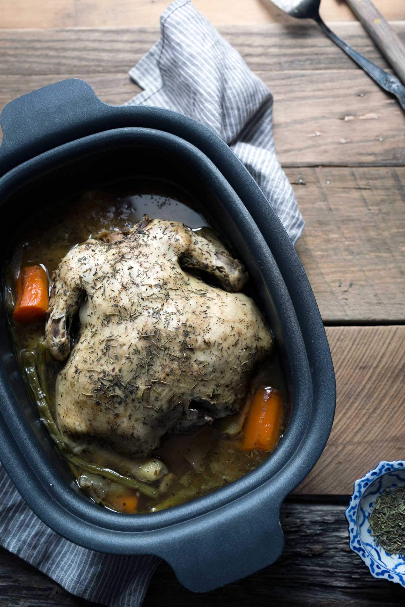 Lemon-Herb Slow Cooker Whole Chicken is an easy "set it and forget it" meal. A few minutes of prep time is all you need for a flavor-packed dinner! SavorySimple.net