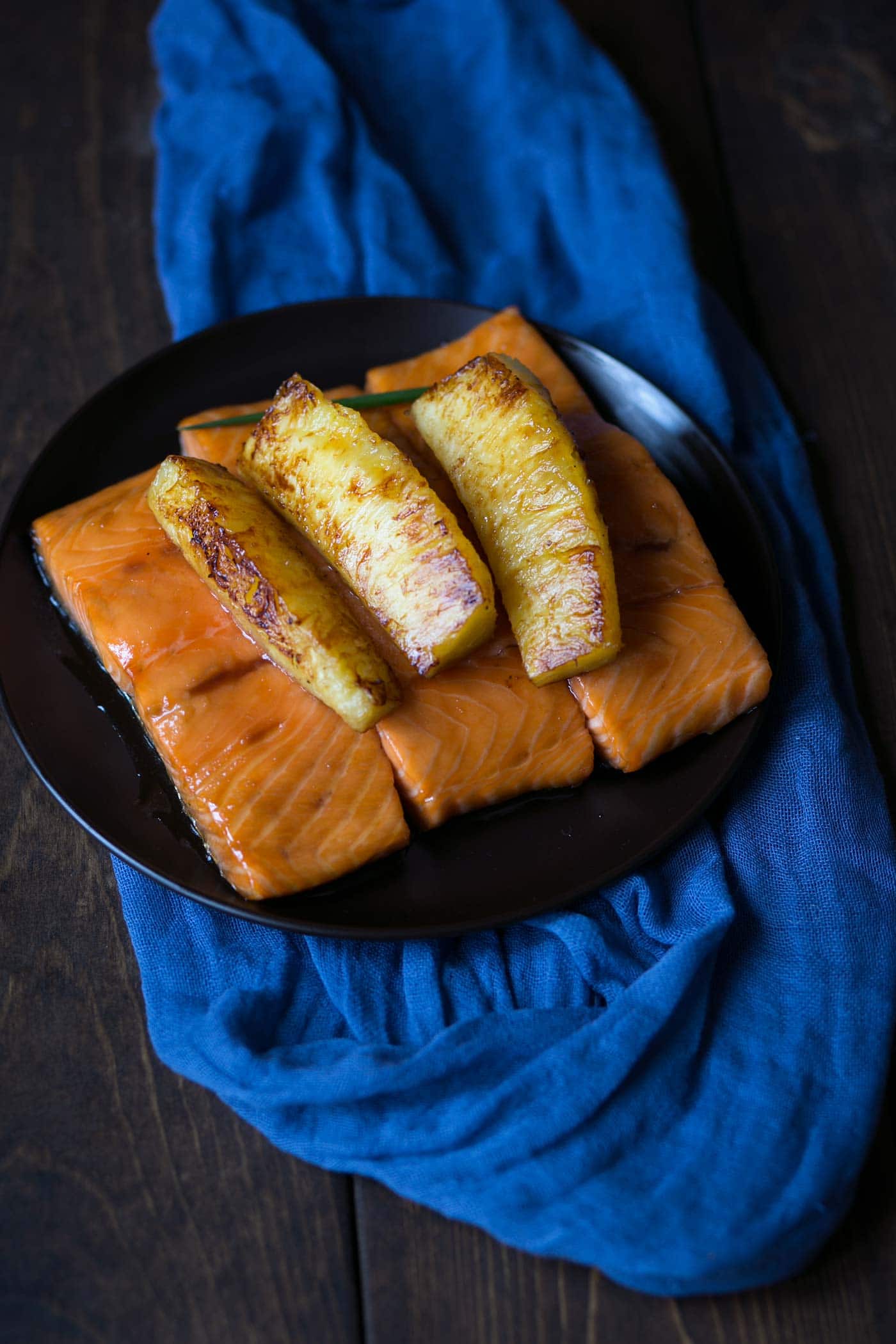 This baked Honey Soy Glazed Salmon with Caramelized Pineapples is a tasty, easy meal with only a few simple ingredients! Dinner is ready in under an hour (and that’s mostly inactive). SavorySimple.net