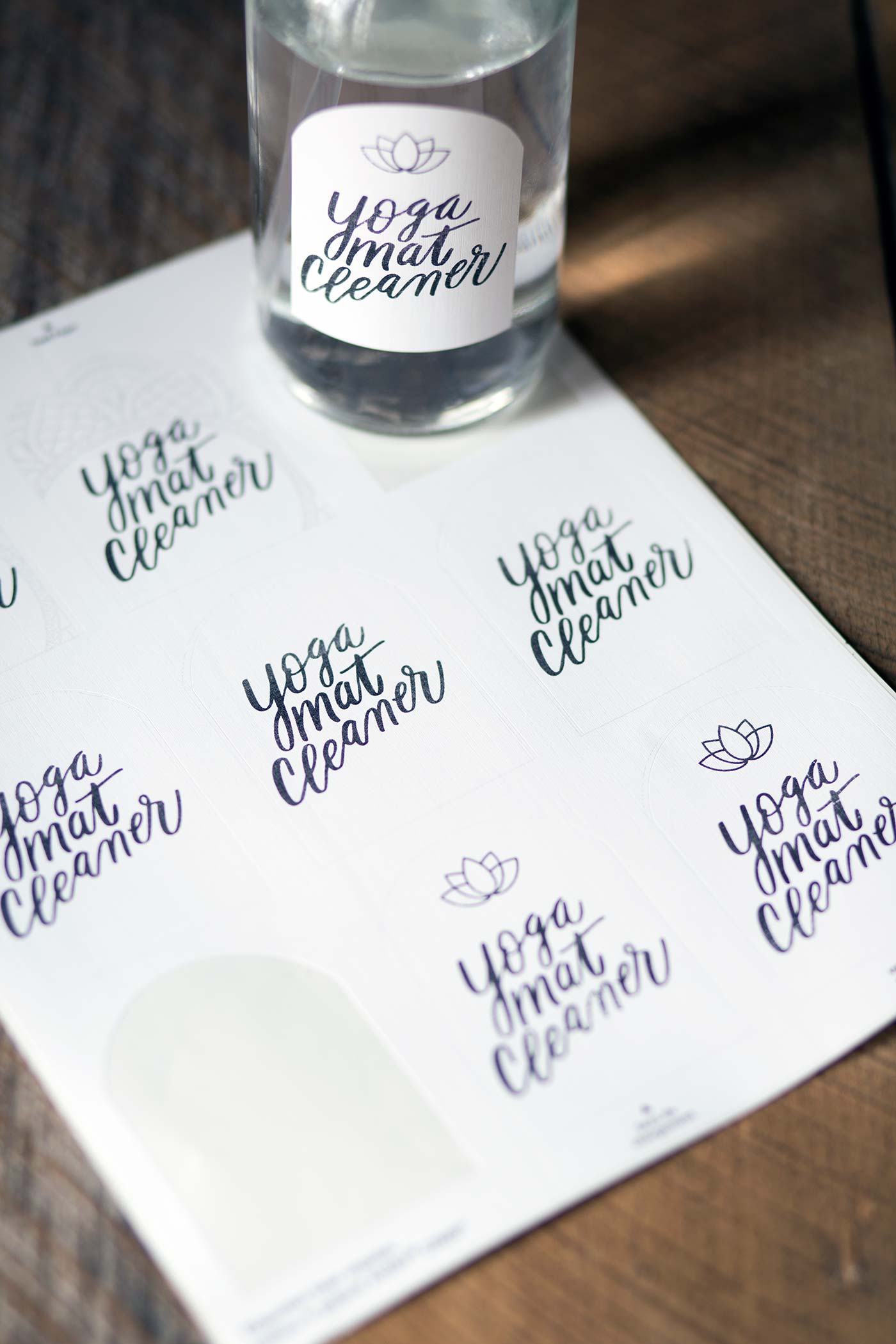 A photo of homemade yoga mat cleaner and free printable labels.