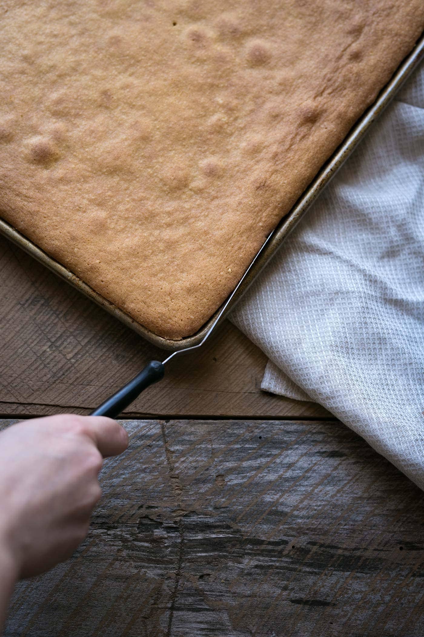 Yellow Sheet Cake with Chocolate Sour Cream Frosting is a perfect cake to serve at parties! The cake is tender, the frosting is sweet and tangy, and the entire thing can be prepped in advance. SavorySimple.net