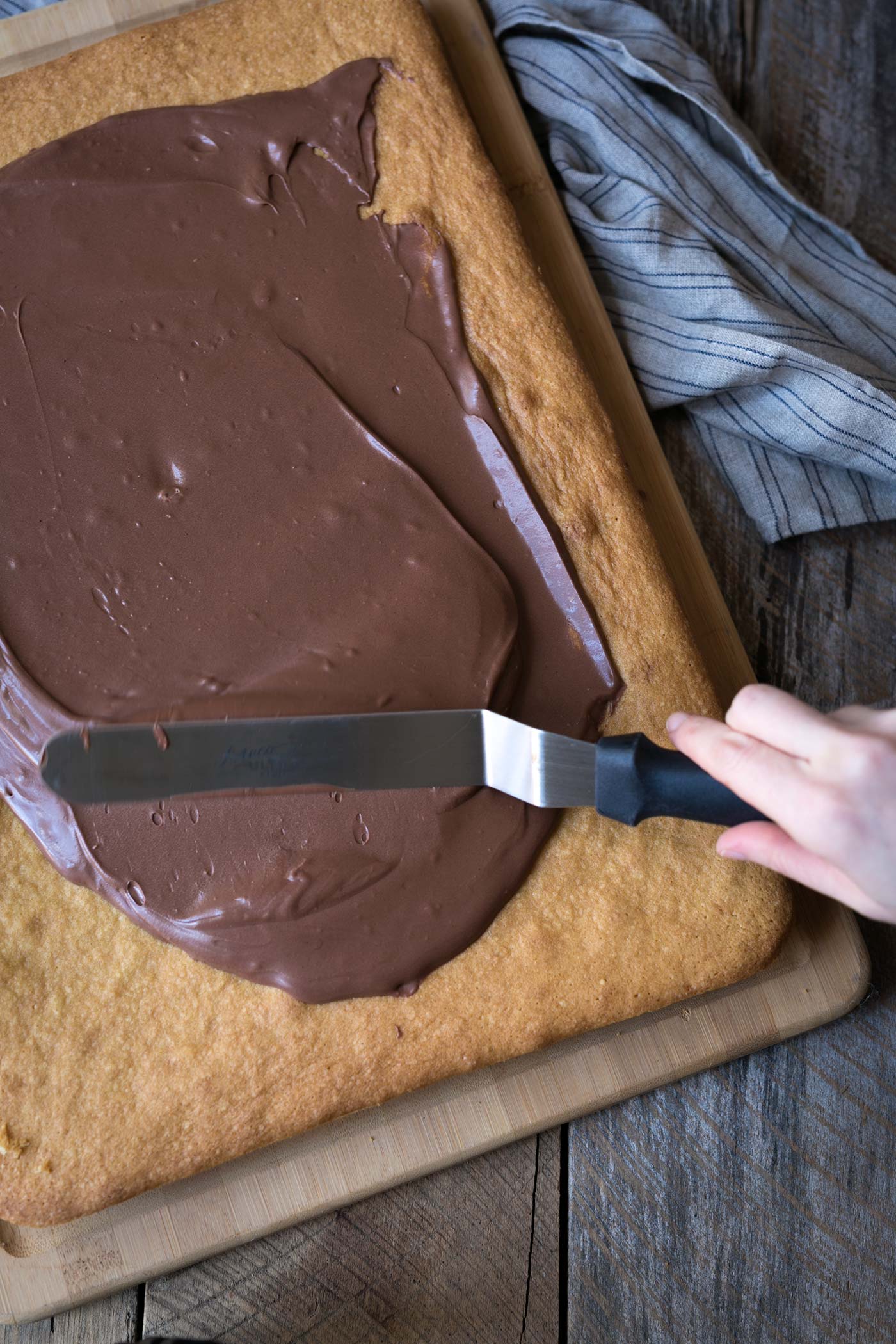 Yellow Sheet Cake with Chocolate Sour Cream Frosting is a perfect cake to serve at parties! The cake is tender, the frosting is sweet and tangy, and the entire thing can be prepped in advance. SavorySimple.net