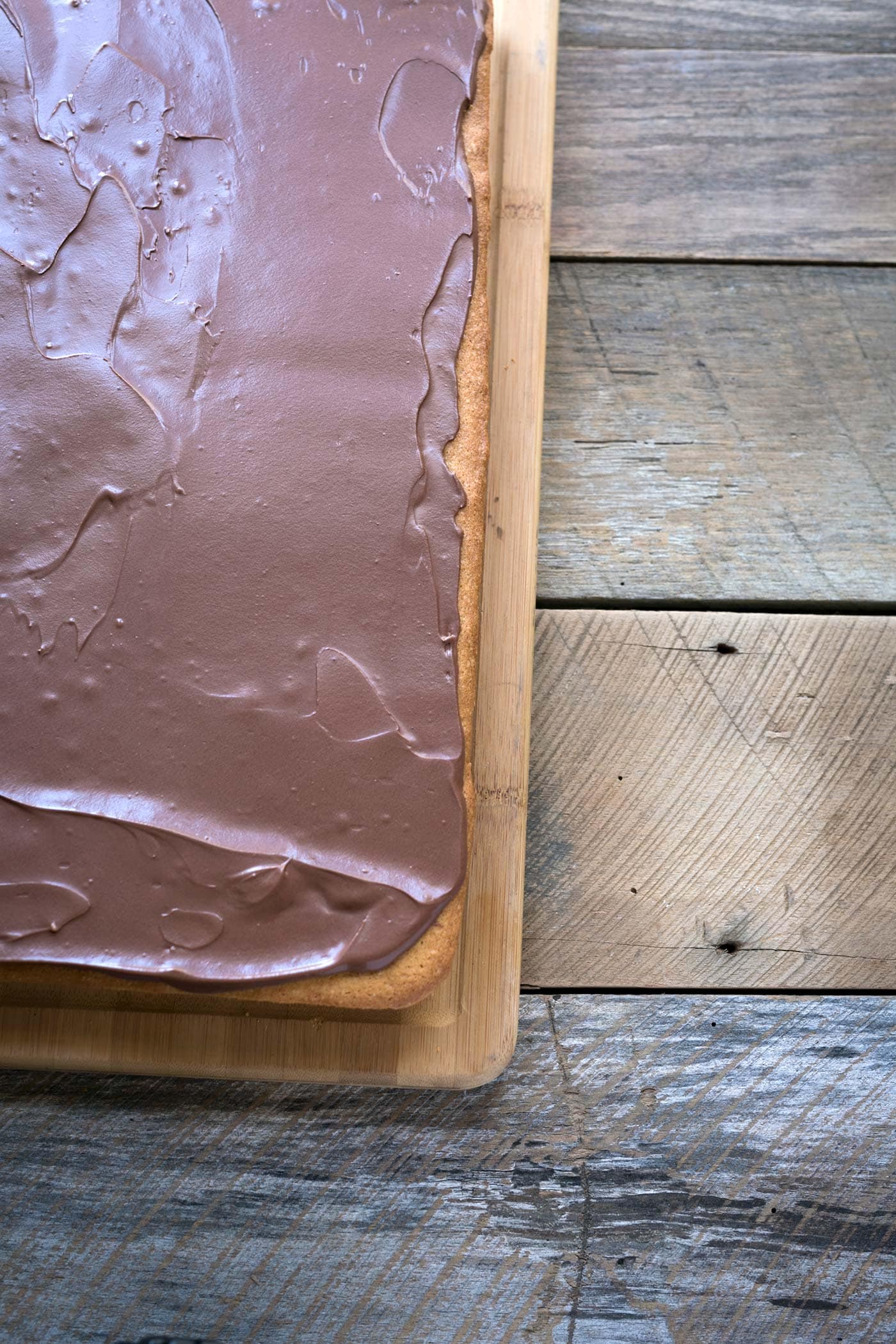 Yellow Sheet Cake with Chocolate Sour Cream Frosting is a perfect cake to serve at parties! The cake is tender, the frosting is sweet and tangy, and the entire thing can be prepped in advance. SavorySimple.net