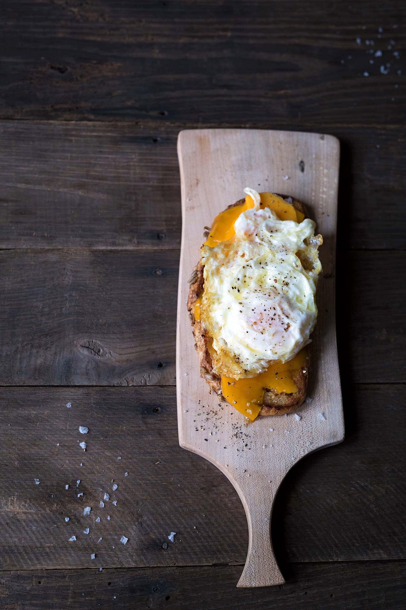 Want a treat yourself? This Open-Faced Grilled Cheese Sandwich is topped with mild cheddar cheese and a Spanish fried egg. It’s total decadence. SavorySimple.net.