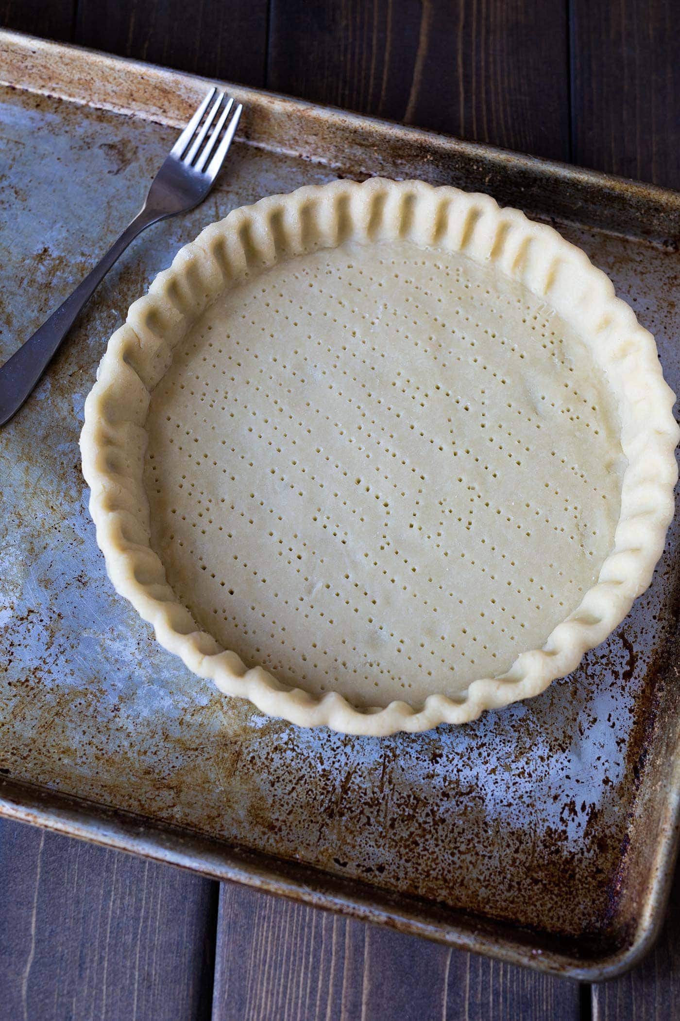 A photo of docked tart dough.