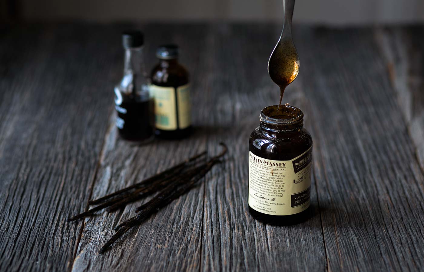 assorted vanilla ingredients: extract, paste, and beans