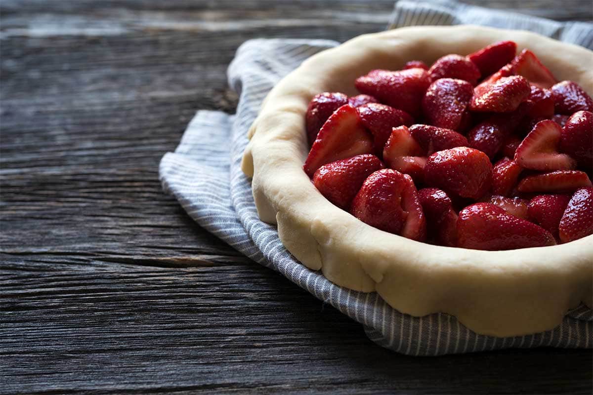 Macerated strawberries in homemade pie dough.